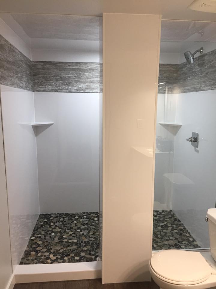 Shower with a Stone floor by Cassidy Dahl, Dahl Tubs, Prince George